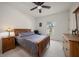 Bedroom with hardwood furniture, neutral walls, and ample natural light from the large window at 2900 W Estrella St, Tampa, FL 33629