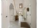 Foyer featuring tile floors, staircase with white banister, and decorative chair at 2900 W Estrella St, Tampa, FL 33629