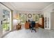 Home office with natural light, wooden furniture, and tile floors at 2900 W Estrella St, Tampa, FL 33629