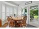 Bright dining area with lots of windows and backyard access at 3101 Beaver Pond Trl, Valrico, FL 33596