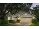 Inviting single-story home with a attached two-car garage and well-manicured landscaping at 3101 Beaver Pond Trl, Valrico, FL 33596