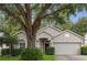 Charming one-story home with a well-maintained front yard and mature tree providing ample shade at 3101 Beaver Pond Trl, Valrico, FL 33596
