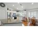 Modern kitchen with stainless steel appliances, granite countertops, and an adjacent dining area at 3101 Beaver Pond Trl, Valrico, FL 33596