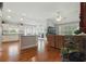 Open concept living area with hardwood floors, ceiling fan, and lots of natural light at 3101 Beaver Pond Trl, Valrico, FL 33596