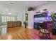 Spacious living room with hardwood floors, a large fish tank, and plantation shutters at 3101 Beaver Pond Trl, Valrico, FL 33596