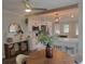 Bright kitchen featuring a wooden beam accent and island with counter seating at 318 W Crest Ave, Tampa, FL 33603