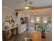 Bright kitchen with wood beam accent, island with counter seating, and round dining table at 318 W Crest Ave, Tampa, FL 33603