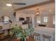 Bright kitchen featuring white cabinets, stainless steel appliances, and a wooden beam accent at 318 W Crest Ave, Tampa, FL 33603