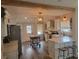 Modern kitchen with white cabinets, a kitchen island, and stainless steel appliances at 318 W Crest Ave, Tampa, FL 33603