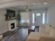 Bright living room with a decorative fireplace, stylish furniture, and a welcoming atmosphere at 318 W Crest Ave, Tampa, FL 33603