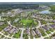 Community overview featuring a centrally located green space, pool, and surrounding homes at 3257 Heart Pine Ave, Odessa, FL 33556