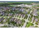 Aerial photograph displays neighborhood with tree-lined streets and well-maintained lawns at 3257 Heart Pine Ave, Odessa, FL 33556