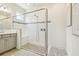Large glass shower with stone floor, tiled walls, and built in seat at 3257 Heart Pine Ave, Odessa, FL 33556