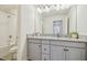 Bright bathroom features a granite countertop, a shower-tub combo, and neutral paint at 3257 Heart Pine Ave, Odessa, FL 33556