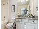Bathroom featuring tile flooring, granite countertop, and shower with tile surround at 3257 Heart Pine Ave, Odessa, FL 33556
