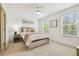 Inviting bedroom with natural light, stylish décor, and comfortable furnishings at 3257 Heart Pine Ave, Odessa, FL 33556