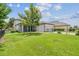 Well-maintained home with a green lawn, a black fence, and a two-car garage at 3257 Heart Pine Ave, Odessa, FL 33556