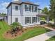 View of home from the side, showcasing landscaping and covered front porch with porch swing at 3257 Heart Pine Ave, Odessa, FL 33556