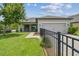 Charming home featuring a well-manicured lawn and a private, fenced front yard at 3257 Heart Pine Ave, Odessa, FL 33556