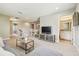 Spacious living room with view to dining area, TV area, and a bathroom at 3257 Heart Pine Ave, Odessa, FL 33556