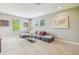 Cozy living room with plush seating, neutral carpet, and abundant natural light at 3257 Heart Pine Ave, Odessa, FL 33556