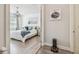 Bright main bedroom with a chandelier, hardwood floors, and calming color palette at 3257 Heart Pine Ave, Odessa, FL 33556
