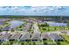 A gorgeous aerial view of the community with mature trees and lush landscaping at 34163 Radley Way, Wesley Chapel, FL 33545