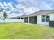 Spacious backyard featuring a well-maintained lawn and privacy fence at 34163 Radley Way, Wesley Chapel, FL 33545