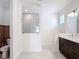 Elegant bathroom featuring a modern vanity, glass-enclosed shower, and sleek fixtures at 34163 Radley Way, Wesley Chapel, FL 33545