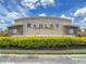 A large stone sign welcomes you to the Radley community, surrounded by lush green landscaping at 34163 Radley Way, Wesley Chapel, FL 33545