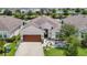 Charming single-Gathering home showcasing well-manicured lawn and inviting two-car garage at 34163 Radley Way, Wesley Chapel, FL 33545