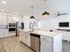 Spacious kitchen features stainless steel appliances, a large island, and an open layout at 34163 Radley Way, Wesley Chapel, FL 33545