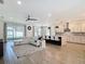 Spacious living area featuring open floor plan flowing to the kitchen and dining area at 34163 Radley Way, Wesley Chapel, FL 33545