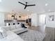 Bright, open living space merges seamlessly with kitchen, creating a modern living area at 34163 Radley Way, Wesley Chapel, FL 33545