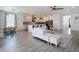 Bright, open living space merges seamlessly with kitchen and dining area at 34163 Radley Way, Wesley Chapel, FL 33545