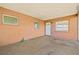 Enclosed back porch area with multiple windows, offering a versatile space for relaxation or storage at 358 Suwanee Ave, Sarasota, FL 34243