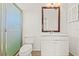 Bathroom featuring single sink vanity, shower stall with glass door and tile flooring at 358 Suwanee Ave, Sarasota, FL 34243
