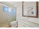 Bathroom featuring single sink vanity, shower stall with glass door and tile flooring at 358 Suwanee Ave, Sarasota, FL 34243