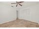 Bright bedroom with neutral walls, a ceiling fan, and tile floors, providing a calm and inviting space at 358 Suwanee Ave, Sarasota, FL 34243