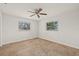 Cozy bedroom with tile floors and natural light from two windows at 358 Suwanee Ave, Sarasota, FL 34243