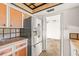 Kitchen featuring stainless steel refrigerator, wooden cabinets, and tile countertops at 358 Suwanee Ave, Sarasota, FL 34243