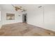 Open-concept living room with tile floors, ceiling fan and natural light at 358 Suwanee Ave, Sarasota, FL 34243