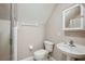 Small bathroom with shower, toilet and sink with cabinet at 39905 Townsend Rd, Dade City, FL 33525