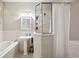 Functional bathroom features a shower stall, a soaking tub and pedestal sink with storage at 39905 Townsend Rd, Dade City, FL 33525