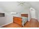 Cozy bedroom featuring hardwood floors, ceiling fan and bright window at 39905 Townsend Rd, Dade City, FL 33525