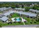 A beautiful aerial view of the condo community with a pool and lush green landscaping at 4215 E Bay Dr # 1801E, Clearwater, FL 33764