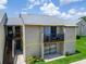Two-story condo building with balconies, manicured lawns, and a well-maintained facade for comfortable living at 4215 E Bay Dr # 1801E, Clearwater, FL 33764