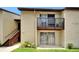 Well-maintained condo exterior boasting private balcony and convenient access to ground floor entrance at 4215 E Bay Dr # 1801E, Clearwater, FL 33764