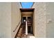 Exterior view of the unit's entrance, featuring a well-maintained staircase, railing, and entryway at 4215 E Bay Dr # 1801E, Clearwater, FL 33764