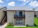 Exterior view of the building, showcasing the units with balconies and well-manicured lawn at 4215 E Bay Dr # 1801E, Clearwater, FL 33764